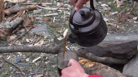 Pouring Tea from Kettle into Cup Video stock 303660793