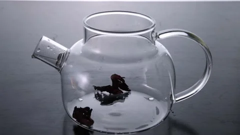 Pouring tea into the kettle Stock Footage 157083038