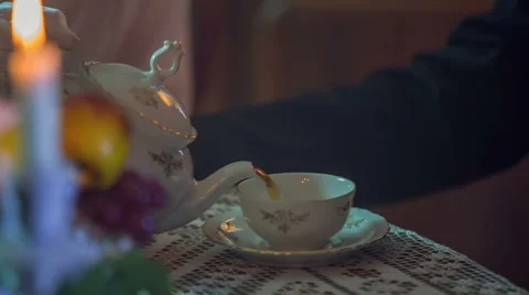 Pouring a tea to make a cup full Stock Footage 49426539