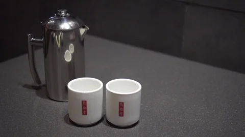 Pouring tea from metal container Video stock 78886266