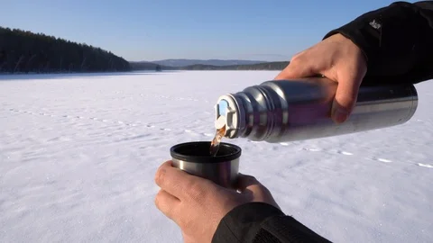 Pouring a tea with natural background Stock Footage 124217596