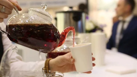 Pouring tea into a paper Cup Stock Footage 129273396