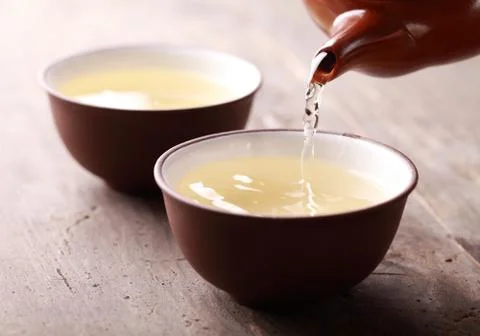 Pouring tea Stock Photos