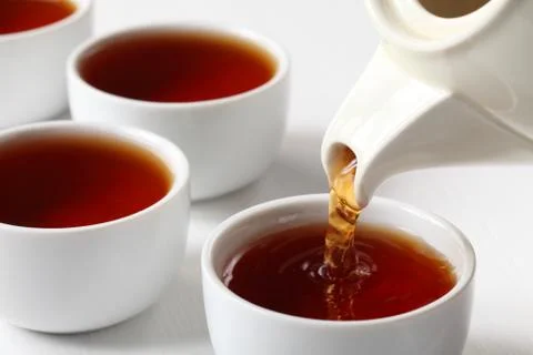 Pouring tea Stock Photos