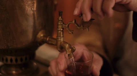 Pouring tea from samovar Stock Footage 32708825