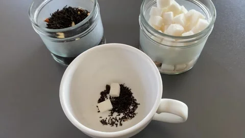 Pouring tea with sugar Stock Footage 341983281