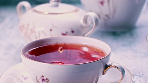 Pouring Tea in Tea Cup on the Table Super slow motion 1000fps Stock Footage 130983632