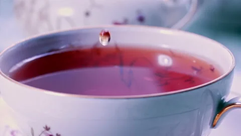 Pouring Tea in Tea Cup on the Table Super slow motion 1000fps Stock Footage 130984465