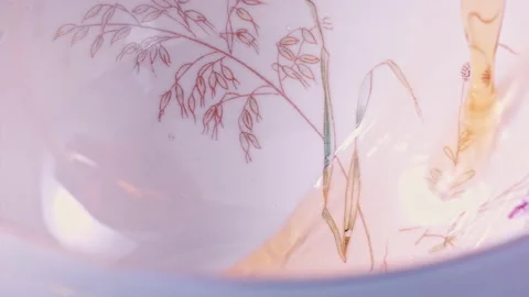 Pouring Tea in Tea Cup on the Table Super slow motion 1000fps Stock Footage 130988095