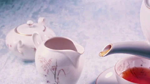 Pouring Tea in Tea Cup on the Table Super slow motion 1000fps Stock Footage 130989217