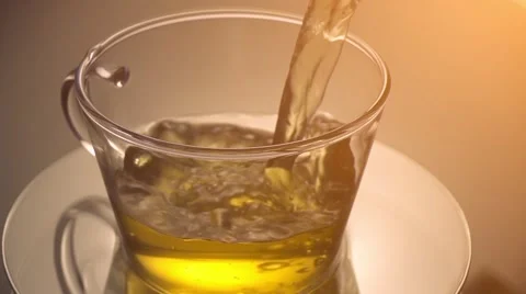 Pouring tea to a teacup Stock Footage 57456295