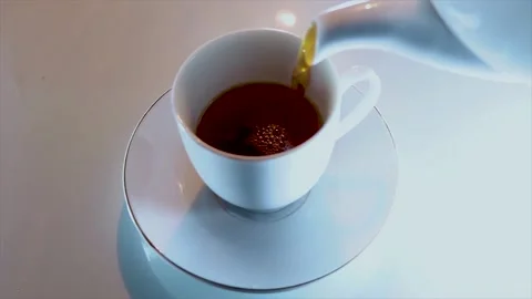 Pouring Tea From The Teapot Into a Cup Video stock 170154575