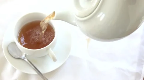 Pouring Tea From a Teapot Stock Footage 65860696