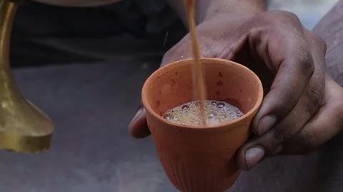Pouring tea in a warm up kulhad in India. Stock Footage 245200548