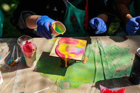 Pouring thick acrylic paint on ceramic tiles. Art training Stock Photos