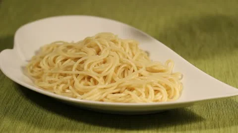 Pouring tomato sauce on spaghetti Stock Footage
