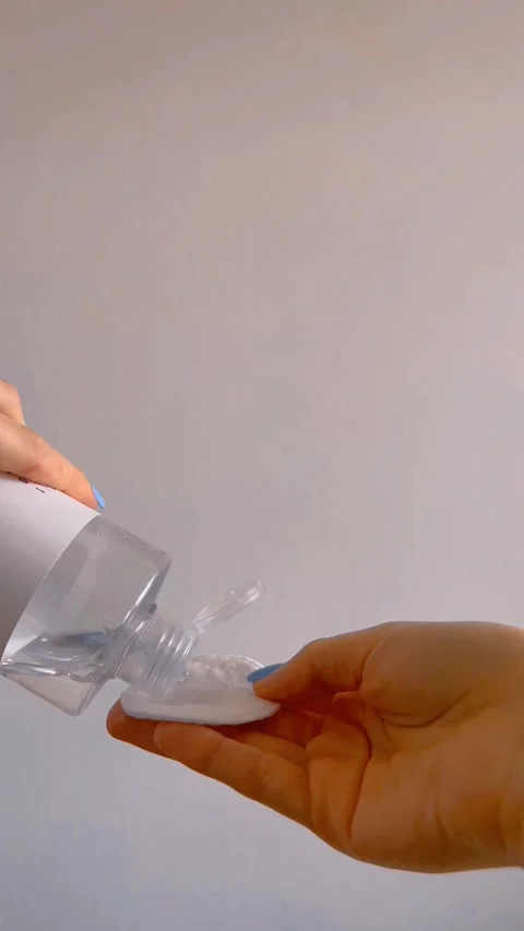 Pouring toner onto a cotton pad Stock Footage 332808476
