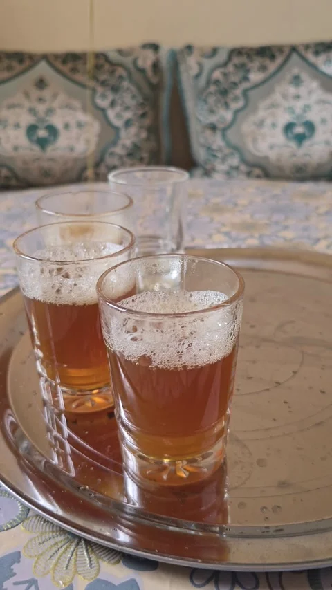 Pouring Traditional Moroccan Mint Tea in a Moroccan Living Room Stock Footage 341739833
