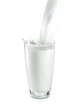 Pouring two glass of milk creating splash, isolated on a white background Stock Photos