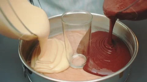 Pouring two types of liquid dough dark and light Stock Footage 252259982