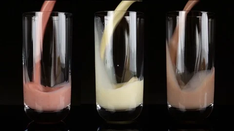 Pouring various Types of Milkshakes in Glasses Stock Footage 123280869