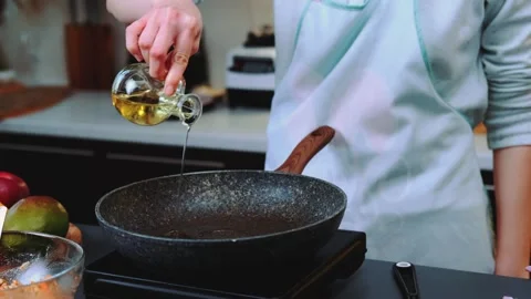 Pouring vegetable oil into the pan Stock-Footage 249681408