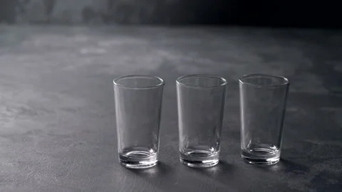 Pouring vodka in glasses close-up. Stock Footage 98973180