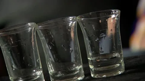 Pouring vodka shots slow motion Stock Footage