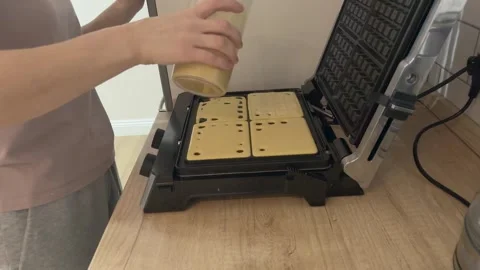 Pouring Waffle Batter From Cup Into Waffle Maker Close Up Cooking Homemade Stock Footage 336443208