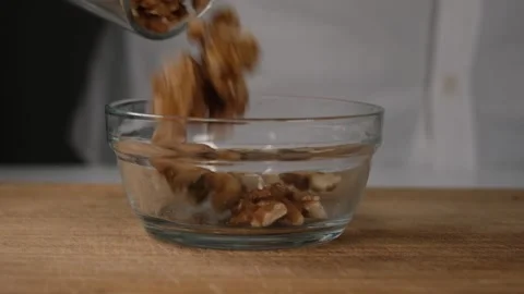Pouring walnut kernel Stock Footage 240134184