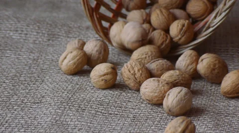 Pouring Walnuts From The Basket On The Tablecloth Closeup Stock Footage 65162306