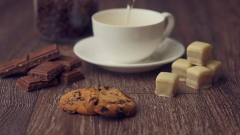 Pouring water and making tea in cup on wooden table. Stock Footage 112676121