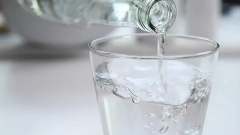 Pouring water from bottle Stock Footage 154614831