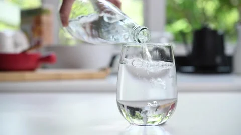 Pouring water from bottle Stock Footage 154614841