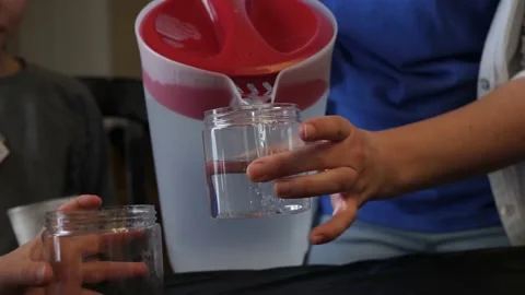 Pouring water to bottles Stock-Footage 144021987