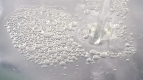 Pouring water into a bowl Stock Footage 313150853