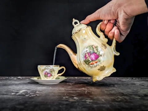 Pouring water into a cup Stock Photos
