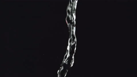 Pouring Water Falling on Black background in Slow Motion Stock Footage 159560173