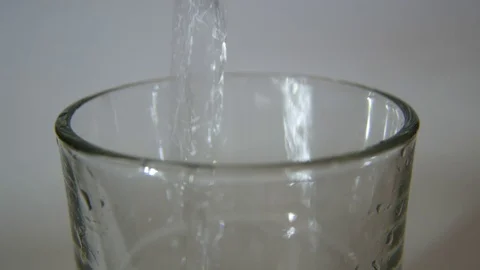Pouring water into the glass Stock Footage 80760852