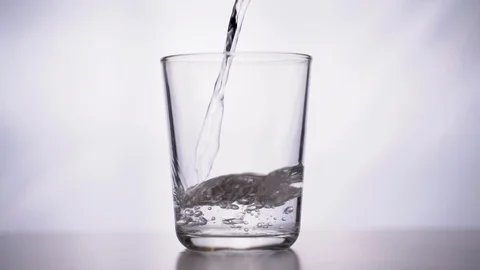 Pouring water into a glass Stock Footage 123769827