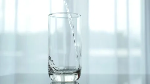 Pouring Water into Glass Indoors Video stock 59144882