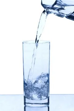 Pouring water into the glass Stock Photos