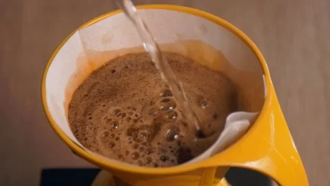 Pouring water on ground coffee - Filter coffee - Close up Stockbeeldmateriaal 139941462