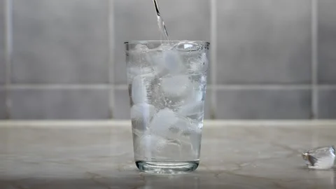 Pouring Water with Ice Cubes Stock Footage 315459154