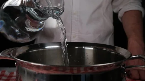 Pouring water into the pot Video stock 240134355