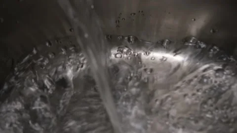 Pouring water into the pot Stock Footage 241030776