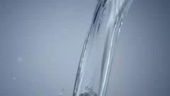 Pouring water into a glass - Stock Image - F006/7235 - Science