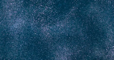 Pouring water with sparkle particles Stock Footage 126059714
