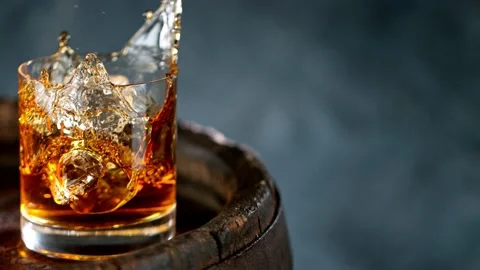 Pouring whiskey on barrel in super slow motion. Stock Footage