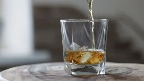 Pouring whiskey into glass. Stock Footage 221787485